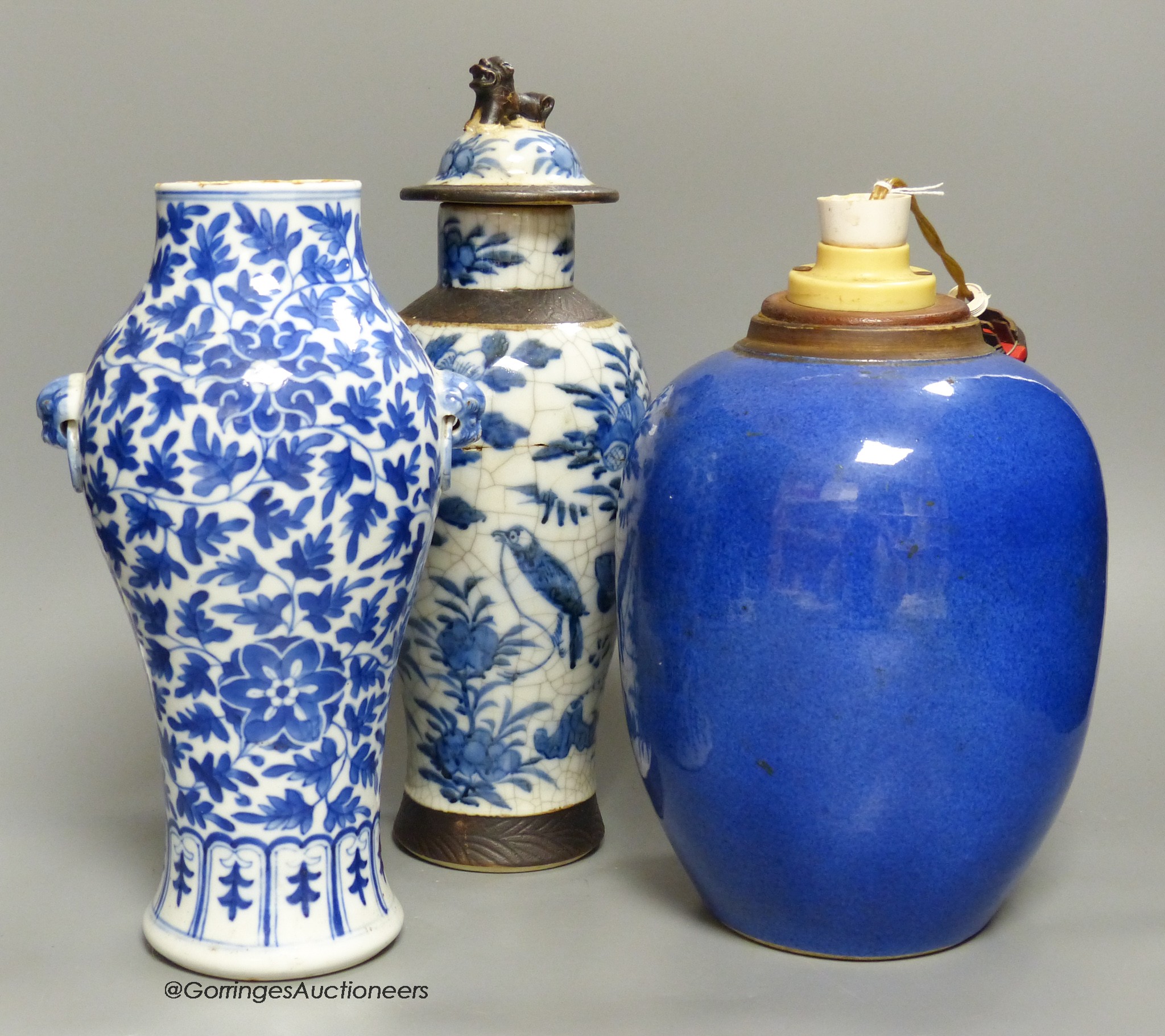 A 19th century Chinese blue and white vase, a similar crackle glaze vase and a powder blue jar, mounted as a lamp, tallest 32cm